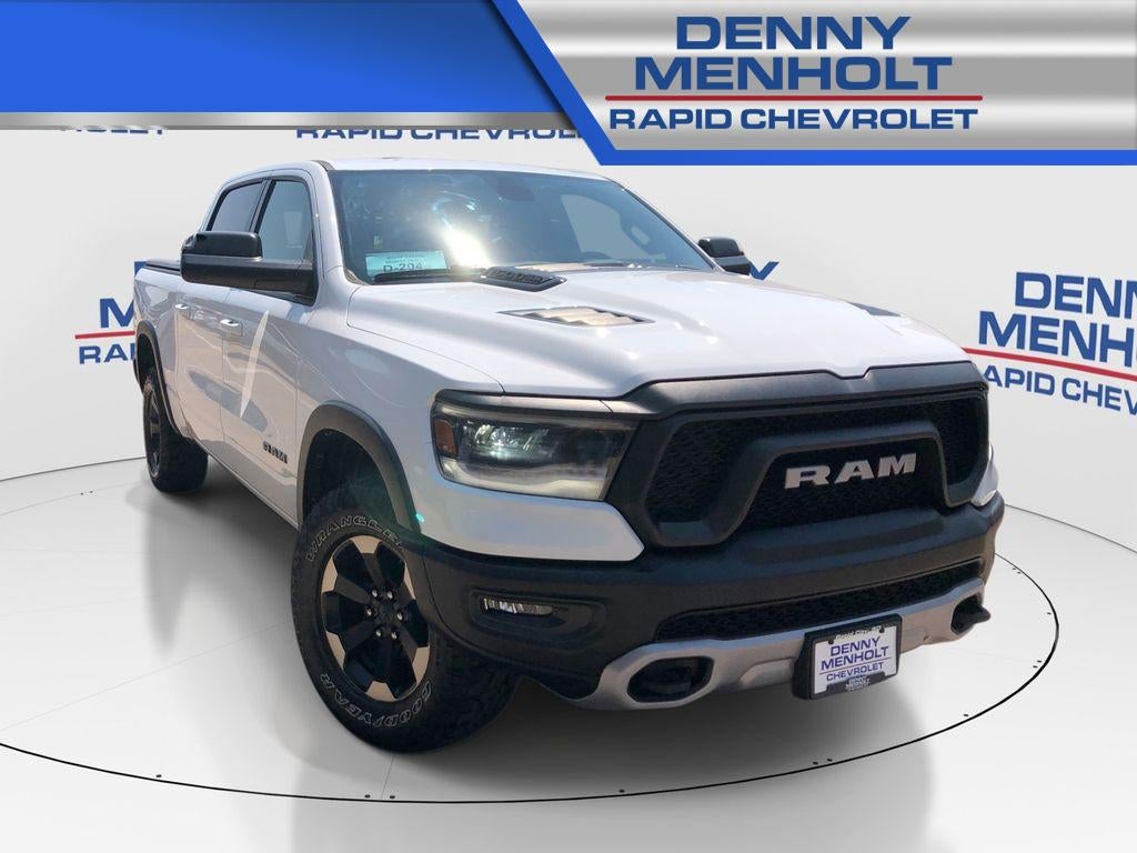 2019 RAM 1500 Rebel Crew Cab 4x4 5'7" Box in White — front three-quarter view