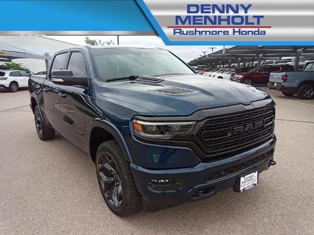 2022 RAM 1500 Limited 4x4 Crew Cab 5'7" Box in Patriot Blue Pearlcoat — front three-quarter view