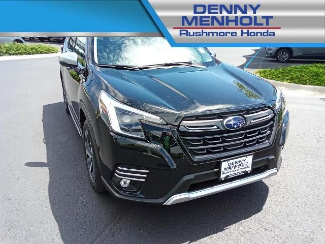 2024 Subaru Forester Touring AWD in Crystal Black Silica — front three-quarter view