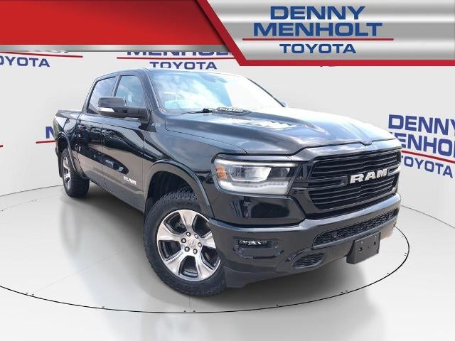 2022 RAM 1500 Laramie 4x4 Crew Cab 5'7" Box in Diamond Black Crystal Pearlcoat — front three-quarter view